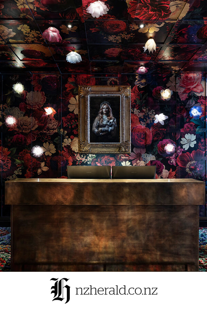 Bar with lights and framed picture for NZ Herald